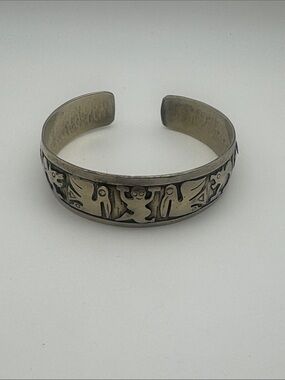 Silver-Tone Cuff Bracelet with Carved Motif
